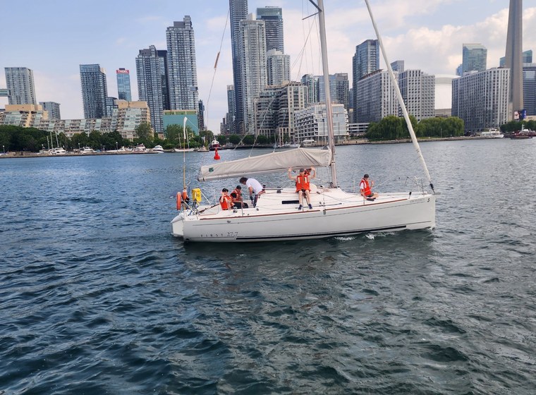 Cadets sailing near the Toronto skyline